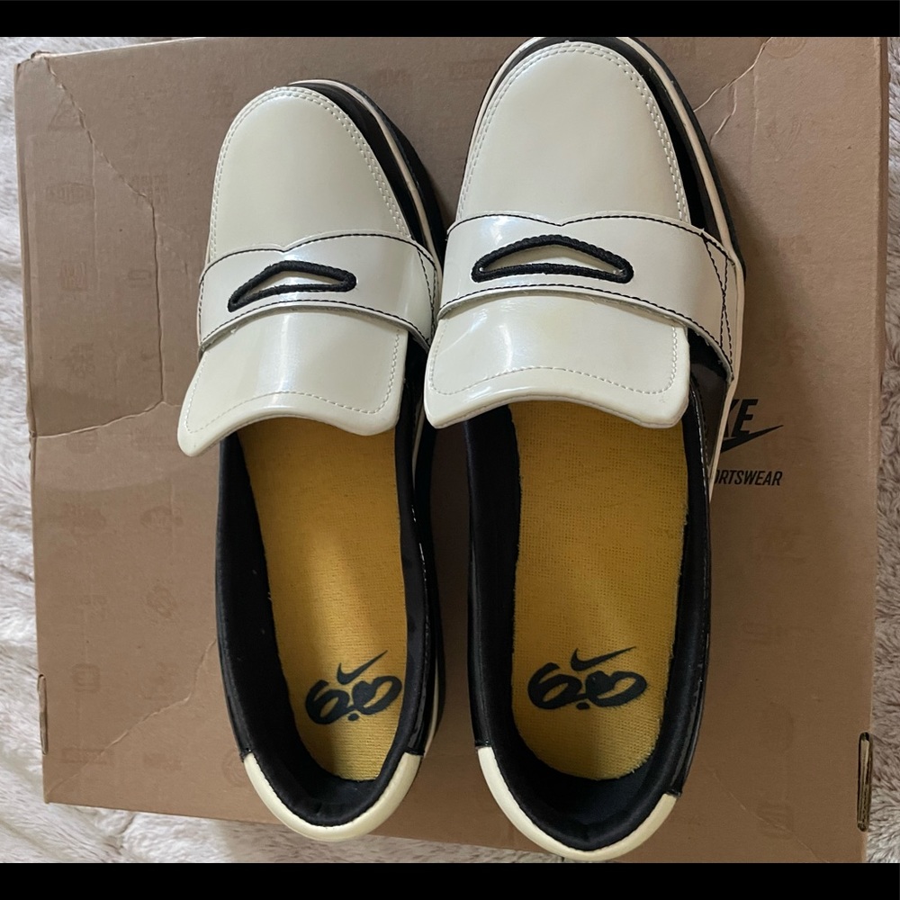 Nike women's balsa loafers, black/white leather. Six 10. Never worn. No box